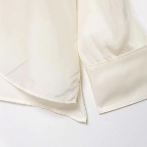 Elegant white silk long sleeve shirt with stand collar and side slit detail for women