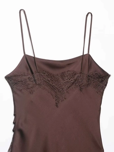 Close-up of chocolate satin camisole with delicate eyelash lace trim at the neckline