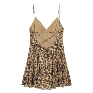 Detail showing back cross-tie ribbons and bow on leopard print mini dress