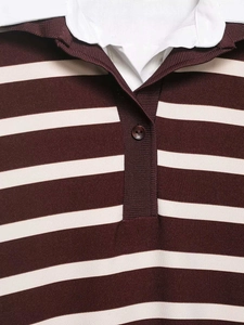 Detailed close-up of the burgundy striped Polo shirt collar with ribbed texture