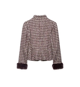 Detail view of the back of a burgundy houndstooth jacket with faux fur cuffs