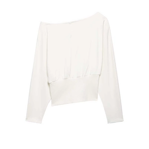 Detail of off-shoulder asymmetric white cotton sweatshirt with ribbed waist and long sleeves