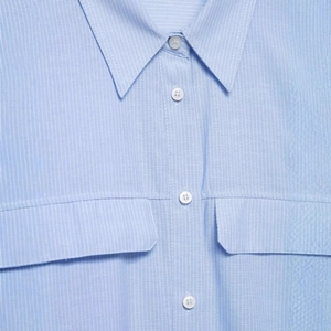 Light blue striped short shirt for women with hidden buttons and chest pockets