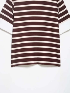 Close-up of burgundy and cream striped polo shirt showing fabric texture and stitching