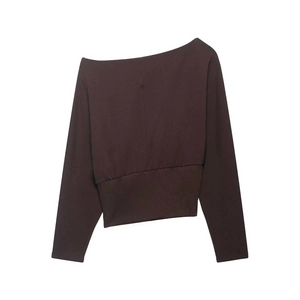 Detail of coffee brown off-shoulder knit sweater with ribbed waist and long sleeves