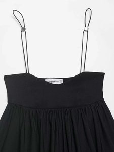 Detail of adjustable metal buckle on black spaghetti straps with BBWM WOMAN neck label