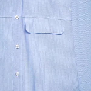 Women's summer light blue striped short shirt with hidden buttons and pocket details