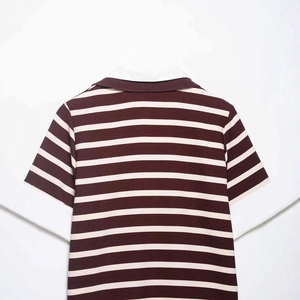 Back view of a striped burgundy polo shirt with short sleeves and white collar detail