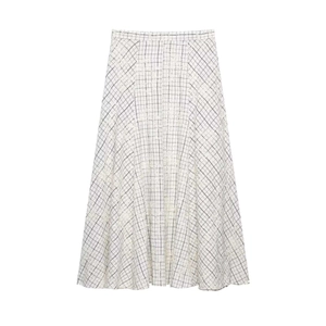 Detailed view of beige A-line skirt featuring black gingham pattern and floral embroidery