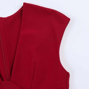 Detailed macro view of V-neckline and invisible zipper on dark red crepe dress