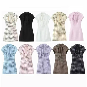 French chic polka dot halter neck mini dress with stylish front cutout and bow tie