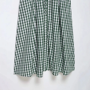 Summer green and white gingham shirt dress with button-down front and cinched waist
