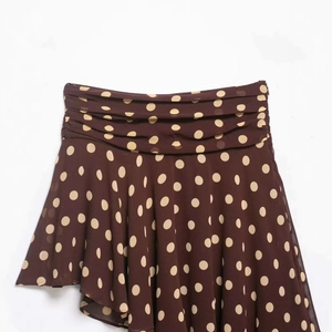 Minimalist dark brown polka dot asymmetrical midi skirt with ruched waist and layered hem