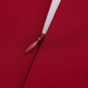 Detail of high-quality concealed zipper on dark red sleeveless A-line summer dress
