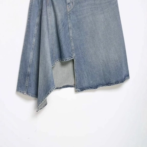 Women's light blue denim skirt with an asymmetrical hem and front slit detail
