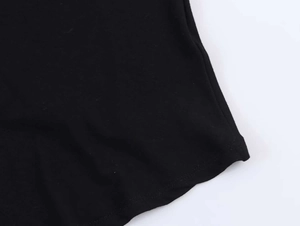 Detail view showing neat stitching and fine knit texture of this black summer dress