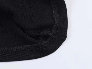 Detail shot of high-quality black knitted fabric with precision double-needle stitching