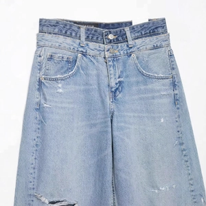 Jean large bleu délavé rétro avec double taille et détails de trous usés style streetwear
