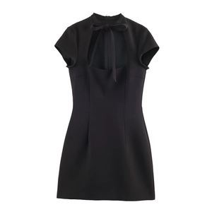 Close-up of black mini dress with bow-tied stand collar and front cutout detail