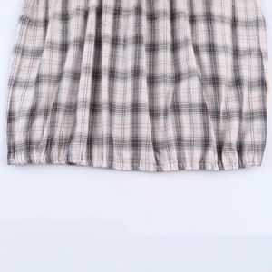 Women's minimalist black and white plaid shirt with puffy sleeves and elastic hem detail