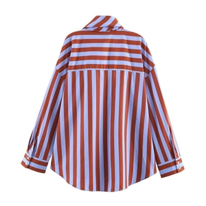 Detailed back view of a loose-fit striped long-sleeve shirt with orange and blue vertical patterns