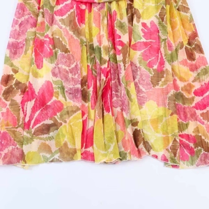 Summer dress with vibrant floral watercolor print and detailed hem stitching details