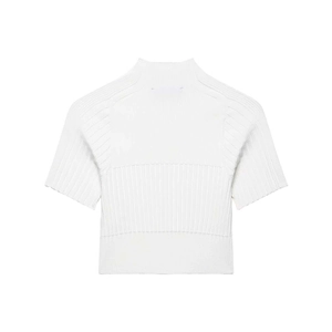 Detailed close-up of the white ribbed knit texture and mock neck on the short sleeve top