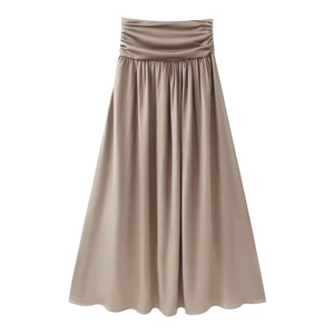 Detail of elegant high-waisted champagne satin maxi skirt with pleated waist design