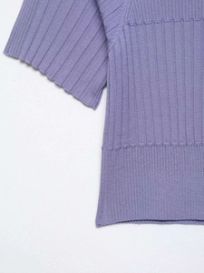 Close-up detail of lilac ribbed knit texture and fine stitching on the short sleeve cuff