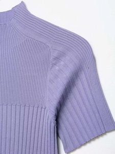 Detailed close-up of lavender mock neck ribbed knit top showing fine fabric texture