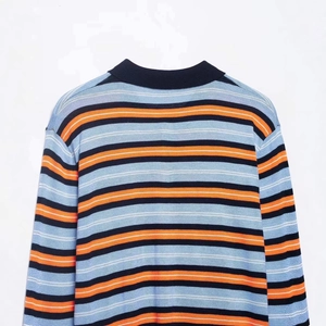 Women's loose knit polo shirt with blue and orange horizontal stripes and black collar