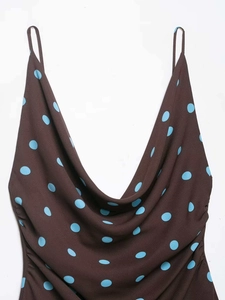 Close-up of brown cowl neck top with blue polka dots and delicate spaghetti straps