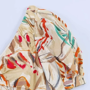 Detail of puff sleeve and floral abstract print on midi dress cotton fabric