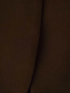 Detailed macro view of the dark brown wool fabric texture and thick material weave