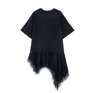 Detail of irregular lace patchwork hem with delicate eyelashes on a black T-shirt