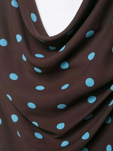Detail of cowl neck on brown top with bright blue polka dots and premium texture