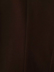 Macro shot of dark brown wool fabric texture with precise stitching detail on the garment