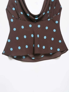Detail of cowl neck design on brown polka dot camisole with adjustable straps