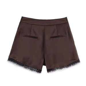 Women's dark brown satin shorts with black lace trim and back pockets on white background