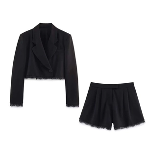 Women black two-piece suit with short blazer and shorts featuring lace trim detail