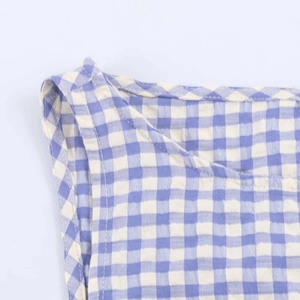 Detail shot of the blue gingham round neckline on this summer midi dress for women