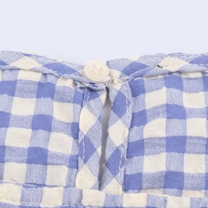 Blue and white gingham midi dress featuring a neck detail with a round white button