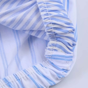 Relaxed blue and white striped cotton shirt featuring elastic waist detail and clean seams