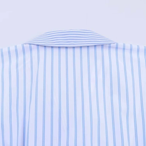 Detail of the blue and white striped poplin shirt neckline with horizontal patchwork