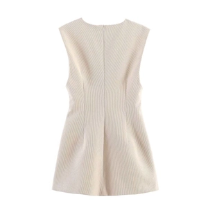 Close-up of the back zip closure and ribbed texture on this cream sleeveless dress