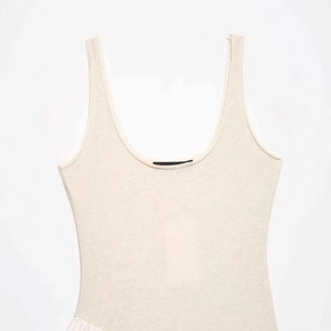 Minimalist cream-white sleeveless U-neck knit tank top with ribbed texture