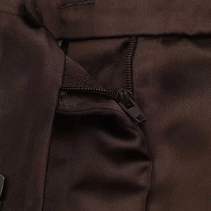 Detail view of the zipper fly and waistband stitching on brown casual high-waist shorts