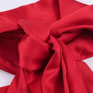 Elegant red satin lace-up top with smooth silk texture and detailed knot design