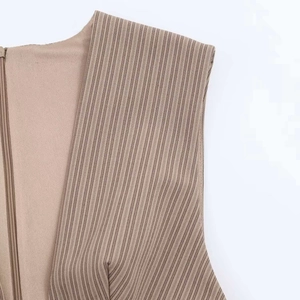 Close-up of brown striped mini dress featuring a concealed side zipper and fine texture