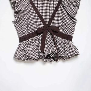Brown gingham balloon top for women with cross-back straps and a large brown bow detail